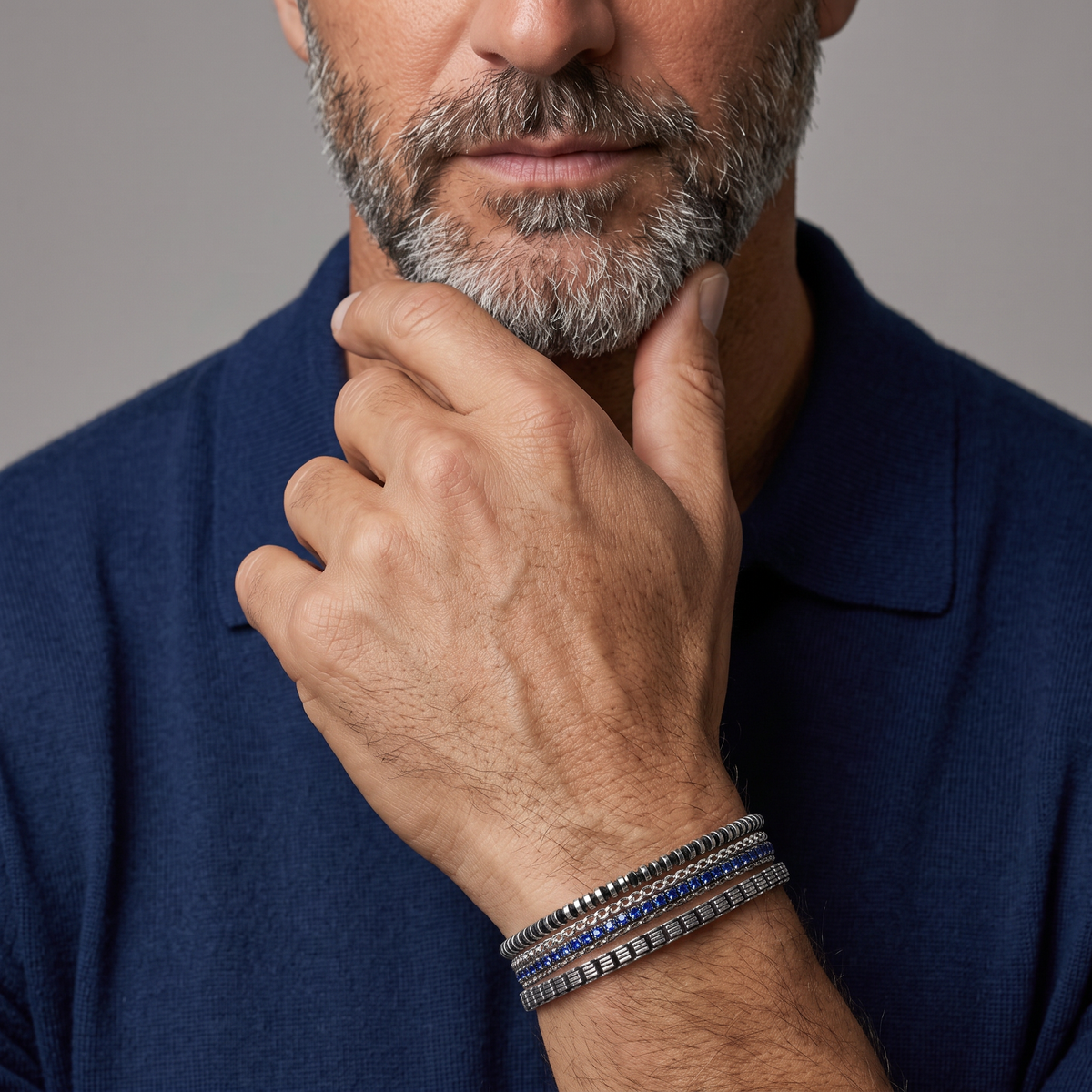 Tateossian men's bracelets stacked on model's wrist