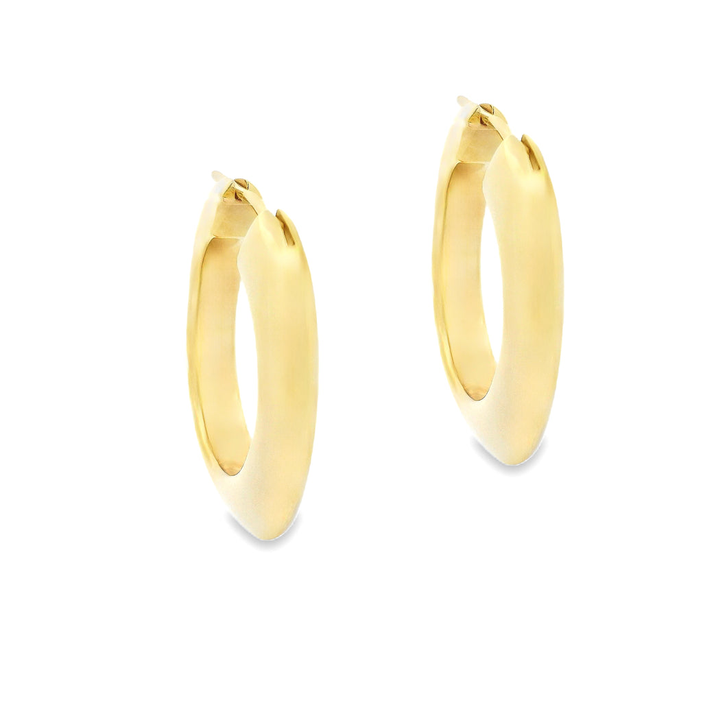18k yellow gold hoop earrings from Tiffany & Co. The hoops are ...