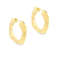 18k yellow gold hoop earrings from Tiffany & Co. The hoops are ...
