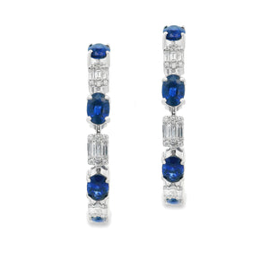 These gorgeous 18k white gold hoop earrings feature 108 round brill...