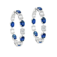 These gorgeous 18k white gold hoop earrings feature 108 round brill...
