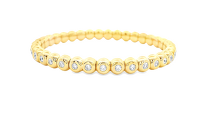 This 18k yellow gold stretch bead bracelet features 37 round brilli...