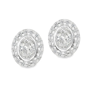 These beautiful 14k white gold earrings feature 2 oval cut diamonds...