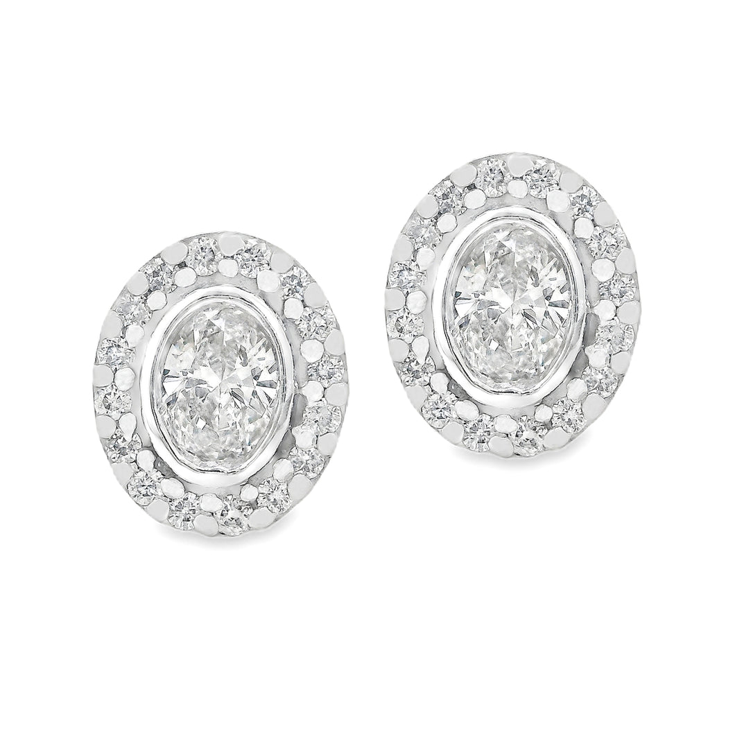 These beautiful 14k white gold earrings feature 2 oval cut diamonds...