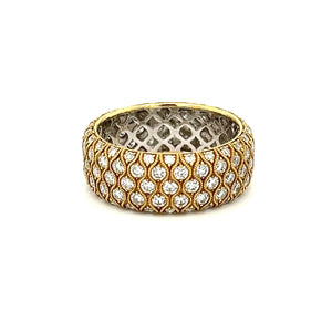 This beautiful and unique 18k yellow gold diamond band features pav...