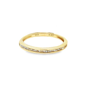 This easy to stack 14k yellow gold diamond band features 13 channel...
