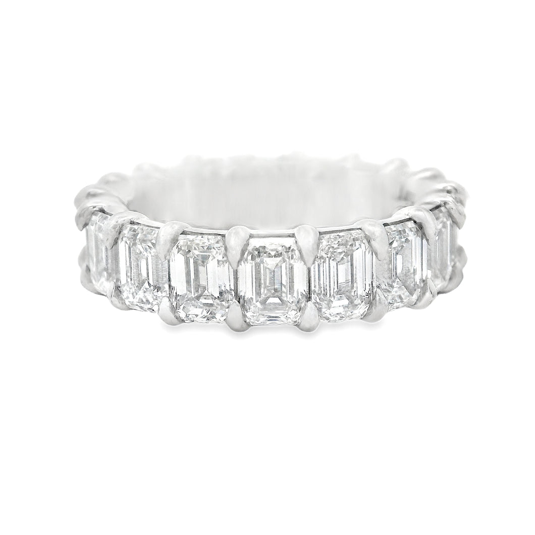 This gorgeous platinum diamond eternity band features 18 emerald cu...