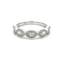 This stylish 14k white gold diamond band features round brilliant c...