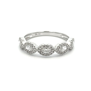 This stylish 14k white gold diamond band features round brilliant c...