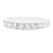 This beautiful 14k white gold diamond band features channel-set rou...