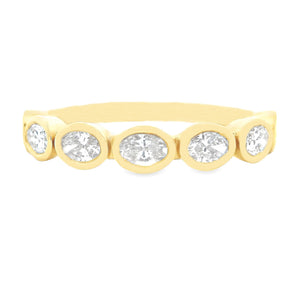 This gorgeous 18k yellow gold diamond band features 7 bezel-set ova...