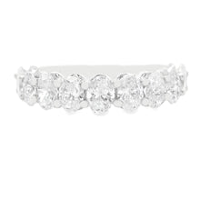 This beautiful 14k white gold diamond band features 11 oval cut dia...