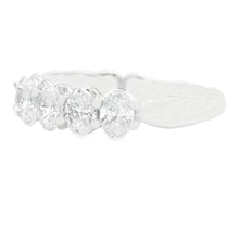 This beautiful 14k white gold diamond band features 11 oval cut dia...