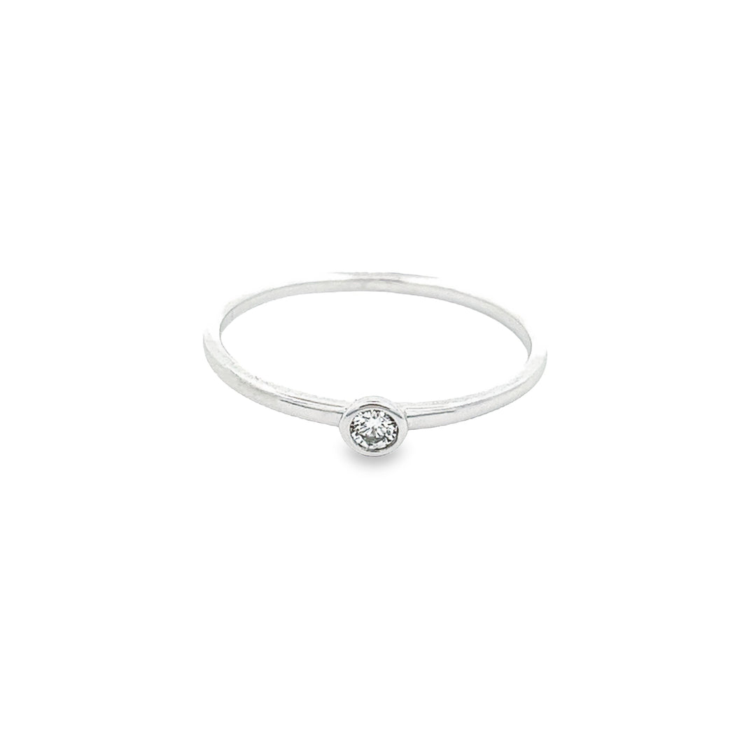  14k white gold ring with a round brilliant cut bezel-set diamond w...