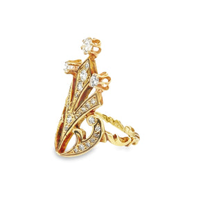 This unique 18k yellow gold ring features 32 round brilliant cut di...