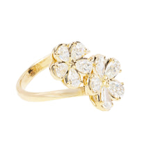 This gorgeous 18k yellow gold diamond flower ring features pear sha...