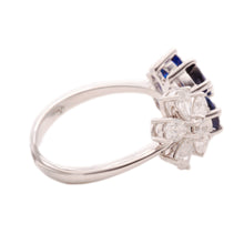This stunning 18k white gold flower bypass ring features 6 diamonds...