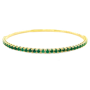 This beautiful 14k yellow gold bangle features emeralds that total ...