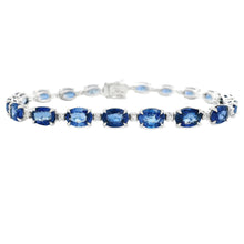 This beautiful 18k white gold bracelet features alternating sapphir...