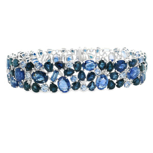 This stunning 18k white gold bracelet features various shades of bl...