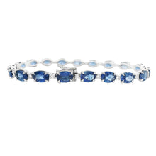 This beautiful 18k white gold bracelet features alternating sapphir...