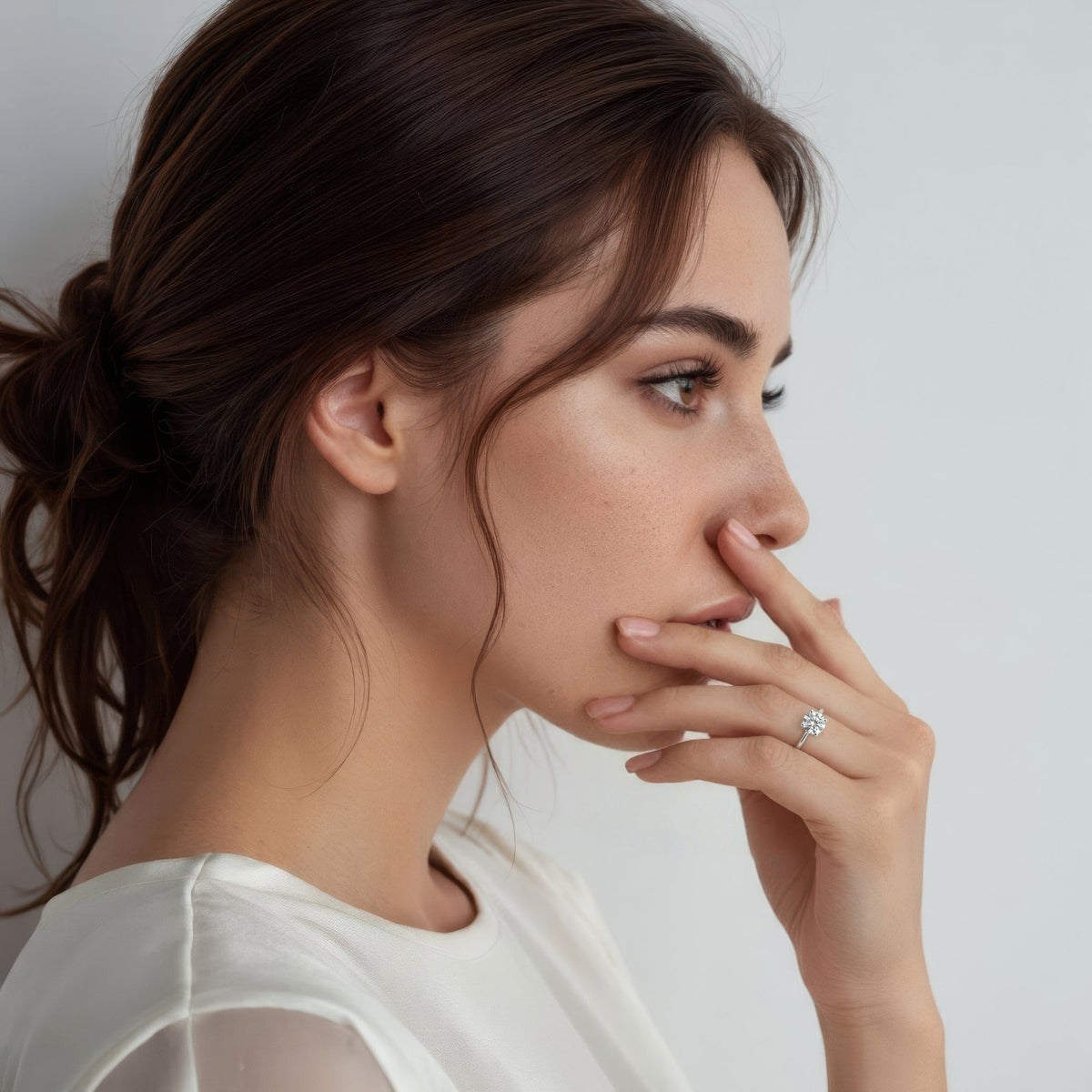 Model wearing a Fana round solitaire diamond engagement ring
