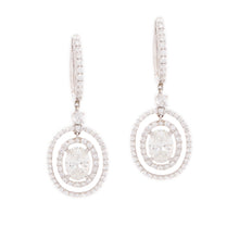 Estate piece. These gorgeous 18k white gold drop earrings feature l...