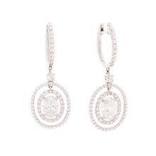 Estate piece. These gorgeous 18k white gold drop earrings feature l...