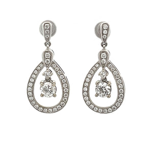 These gorgeous 14k white gold drop earrings feature 2 diamonds tota...
