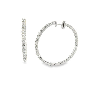 These beautiful diamond hoops feature 84 round brilliant cut diamon...