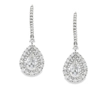 These elegant 18k white gold drop earrings feature 2 pear shape dia...