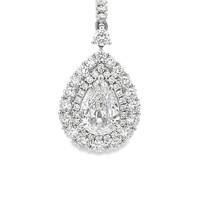 These elegant 18k white gold drop earrings feature 2 pear shape dia...