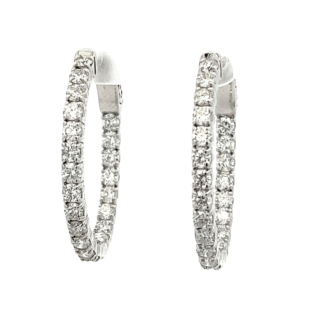 These beautiful 18k white gold diamond hoop earrings feature 42 rou...