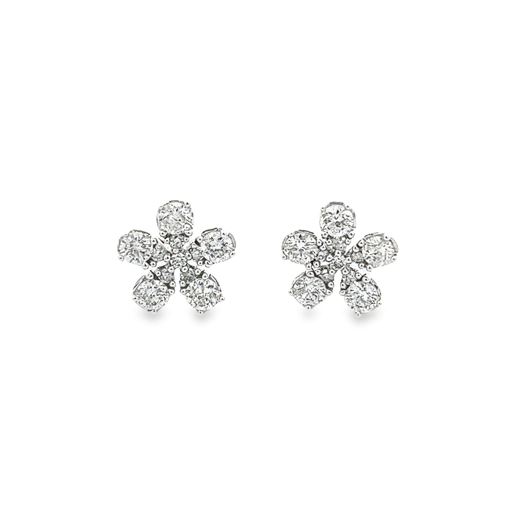 Dainty 14k white gold stud earrings feature pear shaped diamonds as...