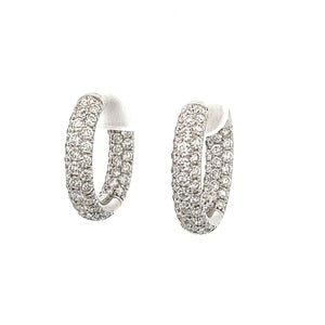 18k white gold huggy hoops featuring 122 diamonds totaling approx. ...
