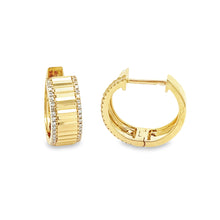 14k yellow gold huggy hoops have a fluted center with diamonds lini...