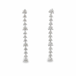 These beautiful 14k white gold drop earrings feature 26 round brill...