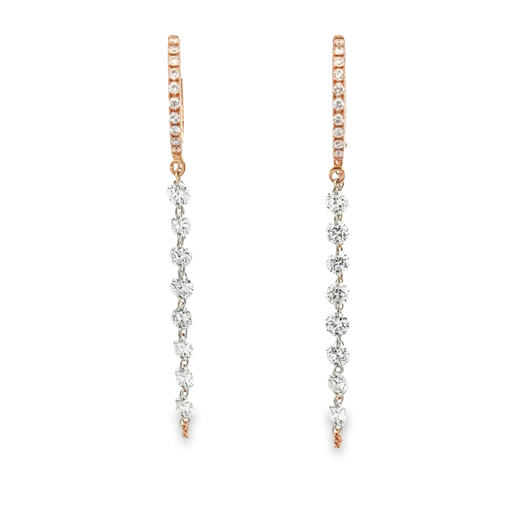 These 14k rose gold huggy earrings feature round brilliant cut diam...