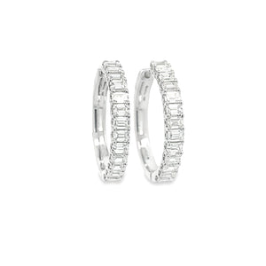 These beautiful diamond hoop earrings feature diamonds totaling app...