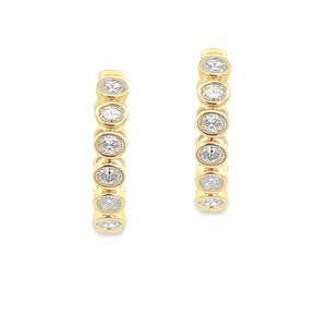 These beautiful 18k yellow gold diamond oval hoop earrings feature ...