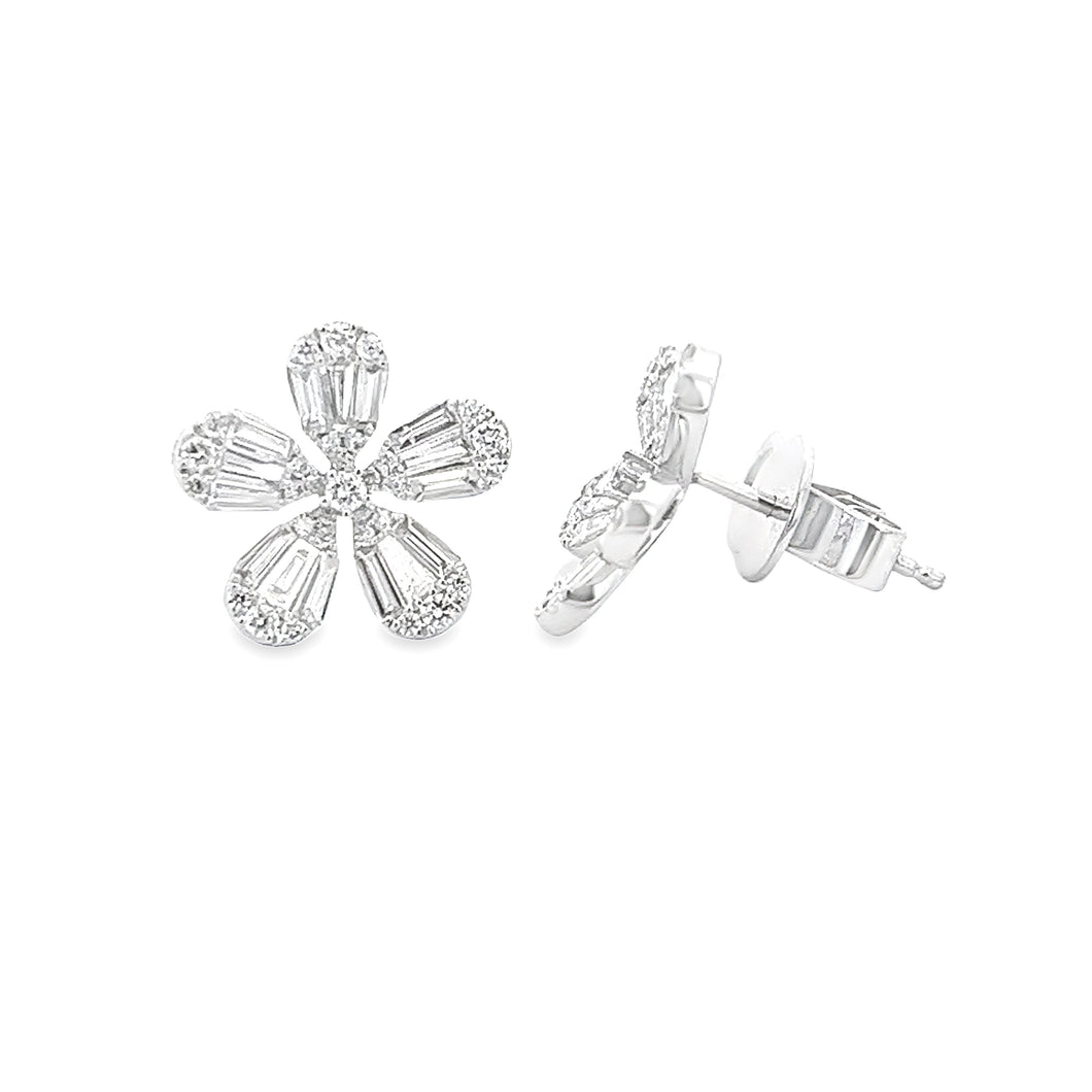 These 18k white gold diamond studs feature baguette and round brill...