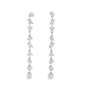 These 18k white gold diamond drop earrings feature a mixture of dia...