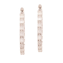 These beautiful 18k white gold diamond earrings from Christopher De...