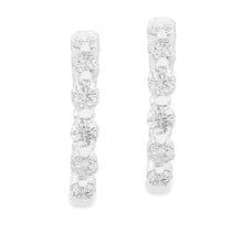 These beautiful diamond hoop earrings feature 20 round brilliant cu...