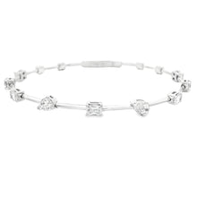 This beautiful 14k white gold bangle features 9 mixed shape diamond...