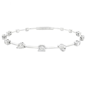 This beautiful 14k white gold bangle features 9 mixed shape diamond...