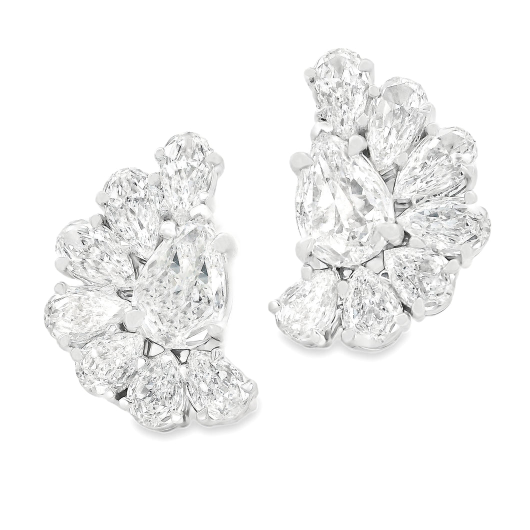 These beautiful 14k white gold diamond earrings feature 16 pear sha...