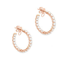 These beautiful 18k rose gold diamond hoops feature 38 oval cut dia...