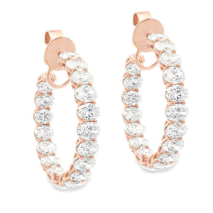 These beautiful 18k rose gold diamond hoops feature 38 oval cut dia...
