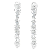 These beautiful 18k white gold diamond dangle earrings feature roun...